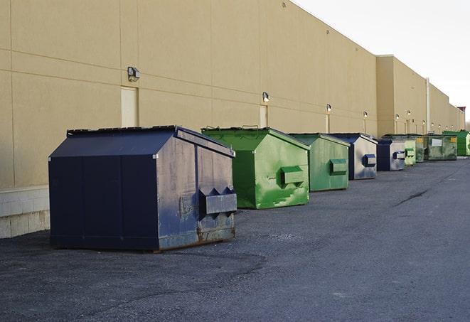 an aerial view of construction dumpsters placed on a large lot in Carson